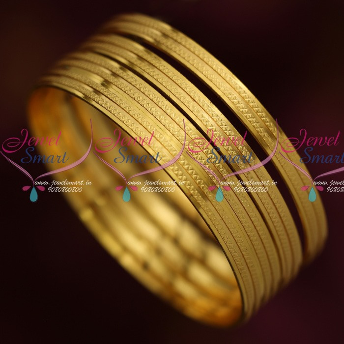 Gold bangle with circle online and line through it